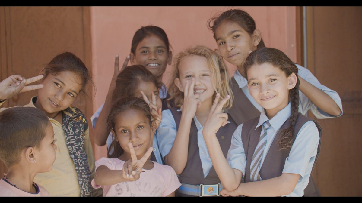 Emilia with her Indian classmates at a local school in India — worldschooling in action